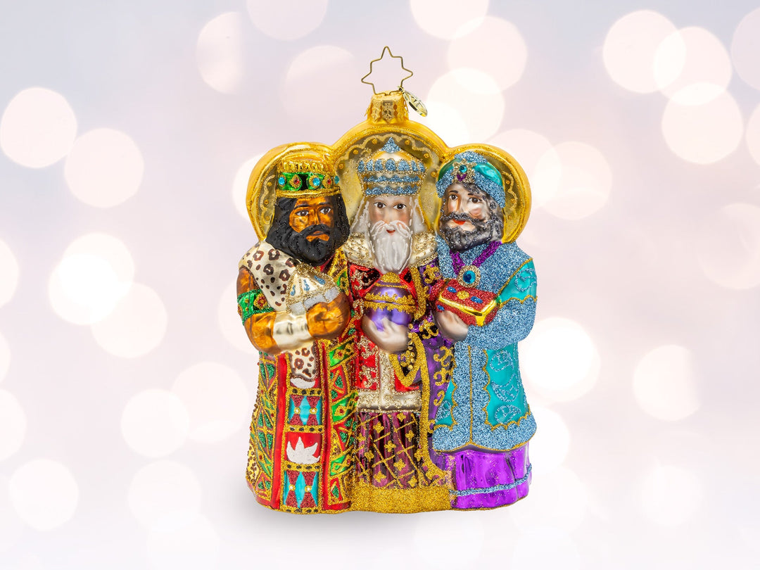 A three wiseman ornament with each wiseman holding their gift of gold, frankincense, and myrrh.