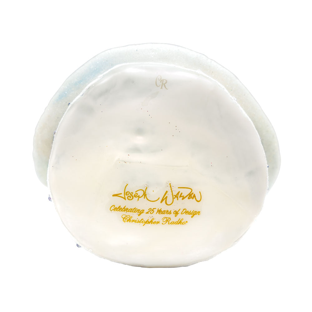 A Santa For All Seasons ornament. Santa in his intricately detailed satin coat surrounded by gifts galore. View  Joseph Walden signature on bottom side of ornament.