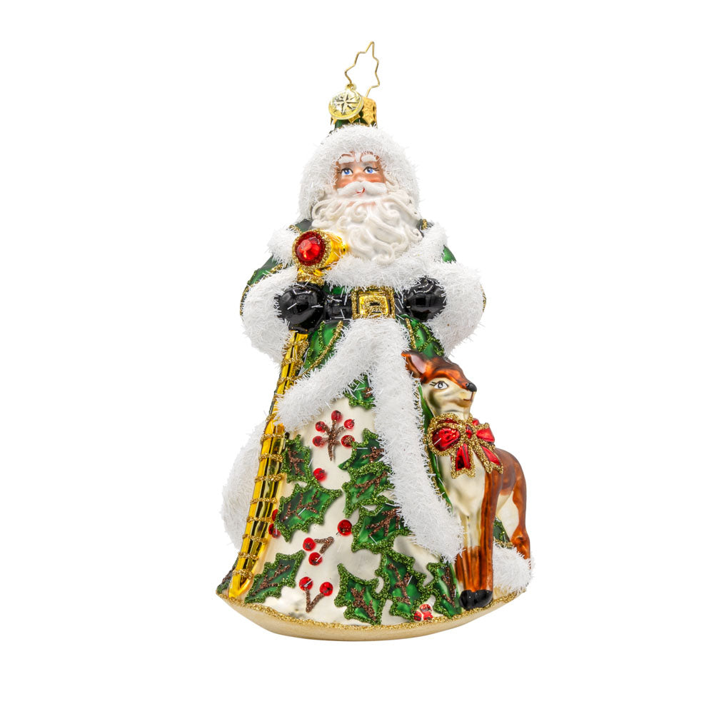 Deerly Beloved Santa ornament. Santa and his reindeer are dressed to impress. Santa dons a green hand-painted coat of holly. The reindeer has a red bow around its neck. View of front.
