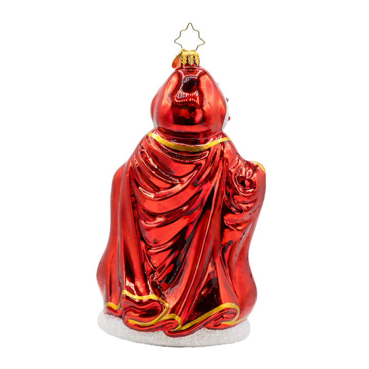 Crimson Noel Santa ornament. With his sparkling red cape, shiny scepter, and gold-detailed gown. View of back.