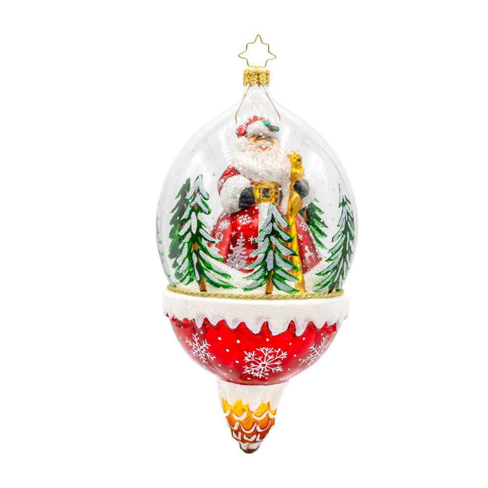 Winter Wanderlust ornament. This dome features a jolly Santa exploring a snowy forest with a playful deer. The shimmering snow, twinkling lights, and festive details create a magical atmosphere. View of front.