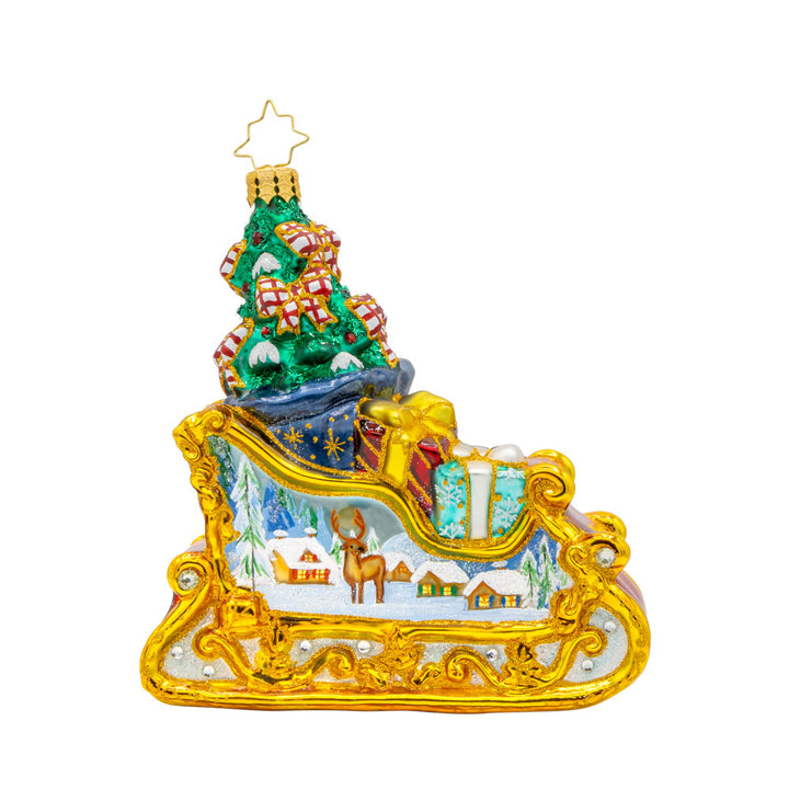 Enchanted Holiday Sleigh ornament. A beautifully crafted sleigh with intricate details, shimmering satin bows, and a hand-painted winter scene. View of left side.