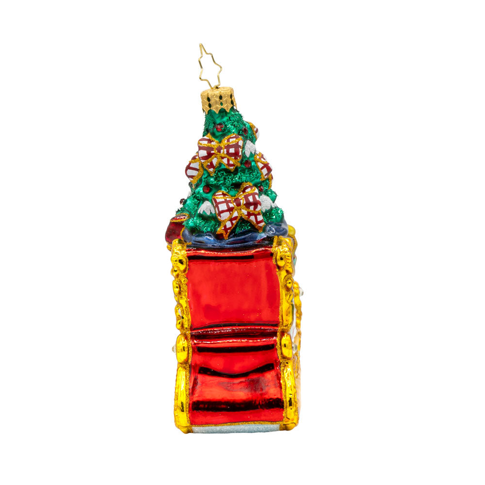 Enchanted Holiday Sleigh ornament. A beautifully crafted sleigh with intricate details, shimmering satin bows, and a hand-painted winter scene. View of back.
