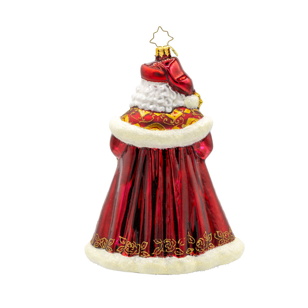 Years In the Making Nick ornament. Santa dons a deep satin red coat and a shimmering gold staff. The intricate patterns on his coat and the attached gems add a touch of opulence and elegance. View of back.