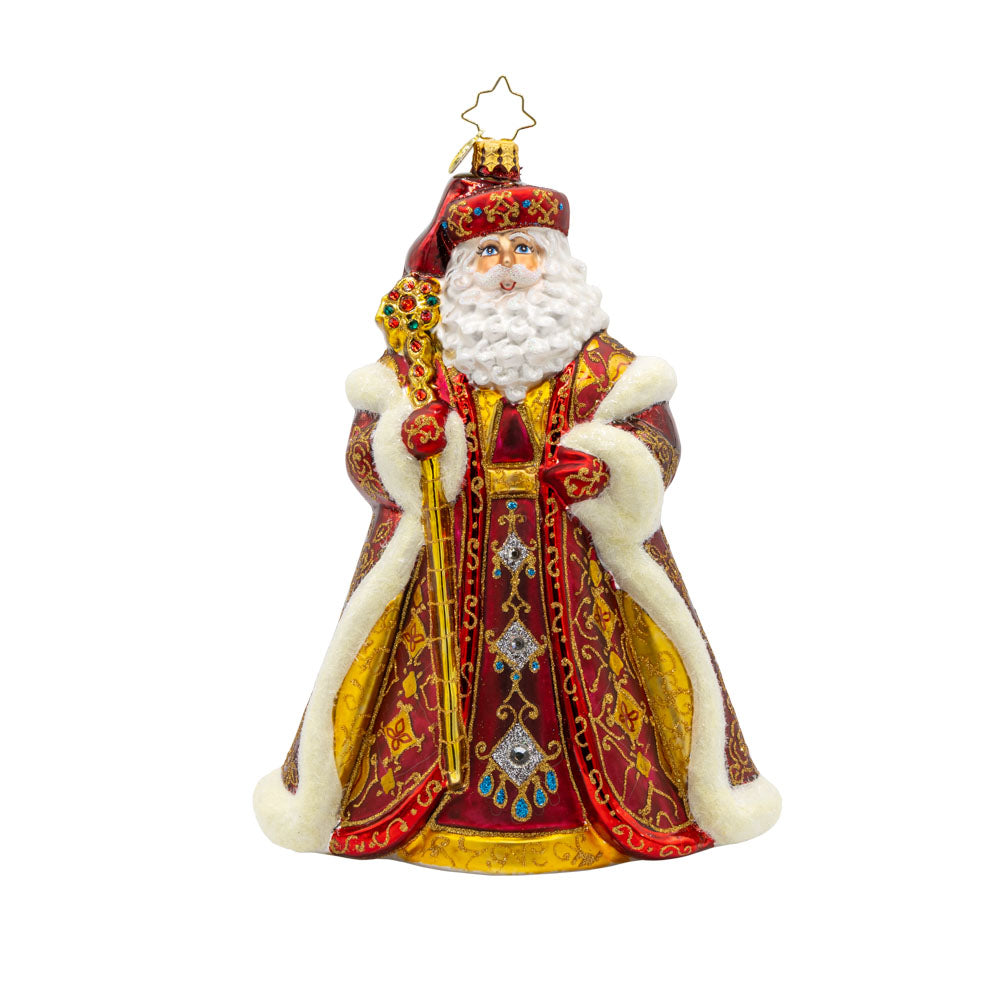 Years In the Making Nick ornament. Santa dons a deep satin red coat and a shimmering gold staff. The intricate patterns on his coat and the attached gems add a touch of opulence and elegance. View of front.
