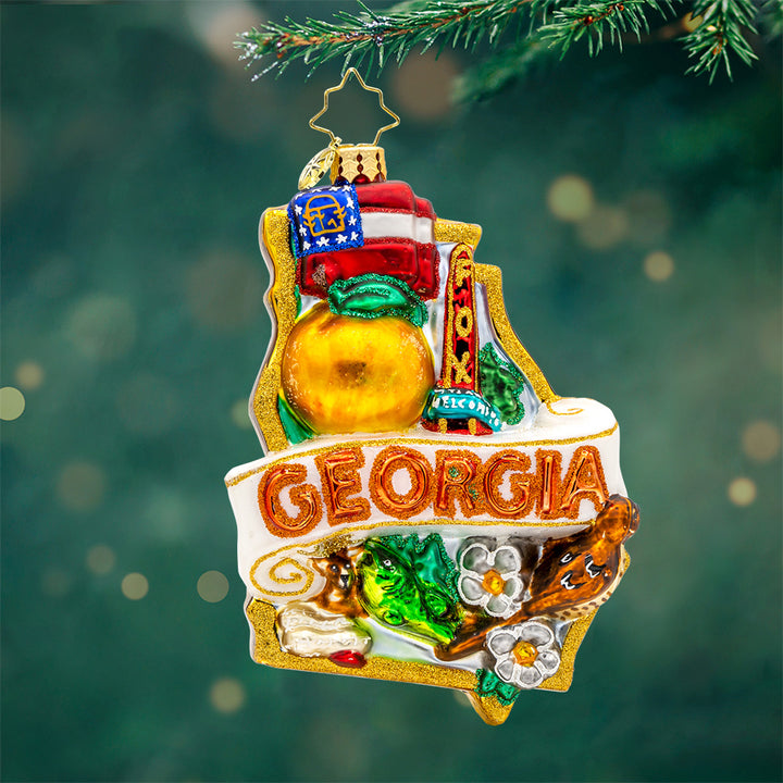 Ornament decorated with all of the wonderful things the great state of Georgia has to offer. View of front.