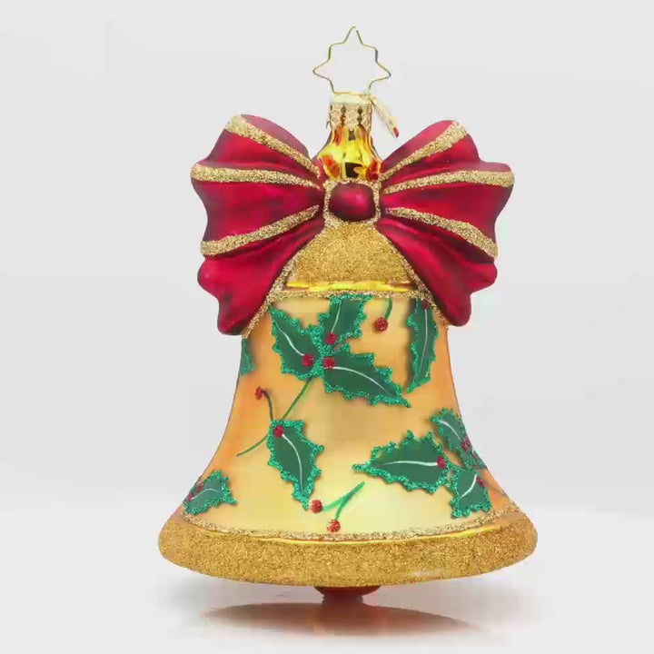 Bell Bliss ornament. A glittery gold bell donned with a red ribbon and hand-painted holly. Video.