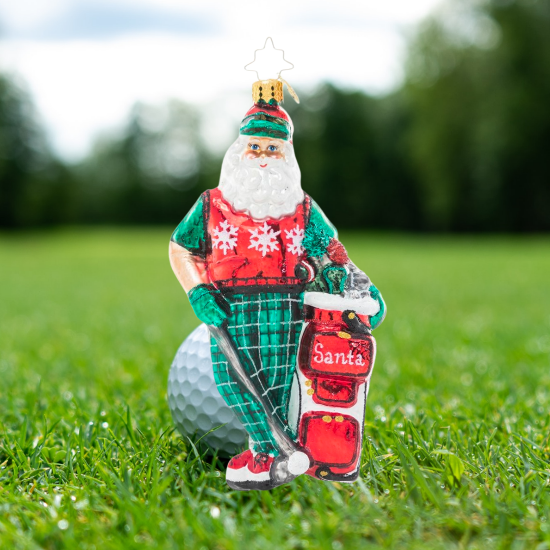 Ornament Description - Jolly Golfer Santa: When he's not preparing for Christmas, Santa gets his swing on at the golf course. He's hoping for a ho-ho-hole in one!