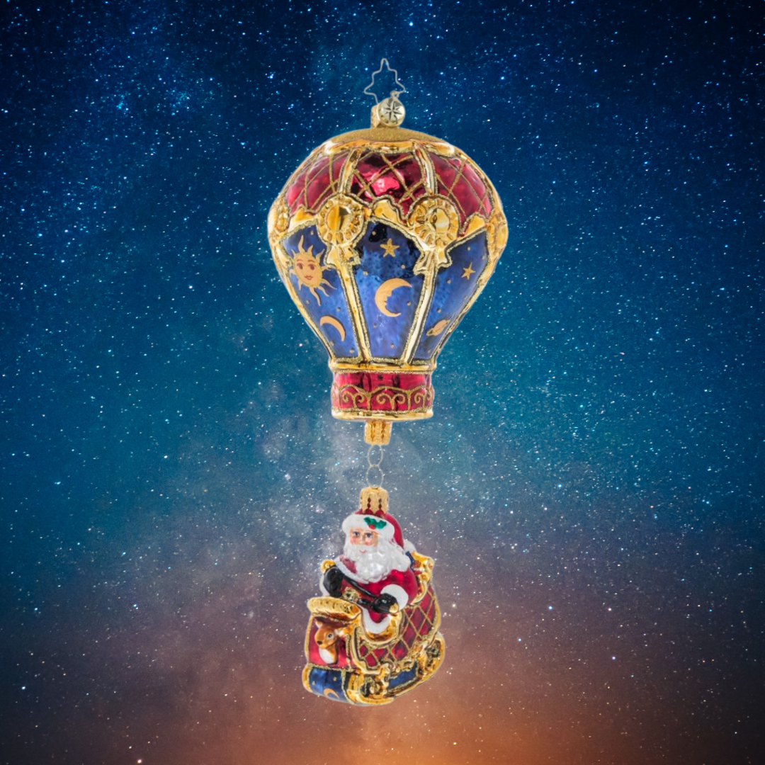 Ornament Description - Among the Stars: Up, up, and away! Santa and his golden sleigh float gracefully through the night sky with the help of a celestial hot air balloon.