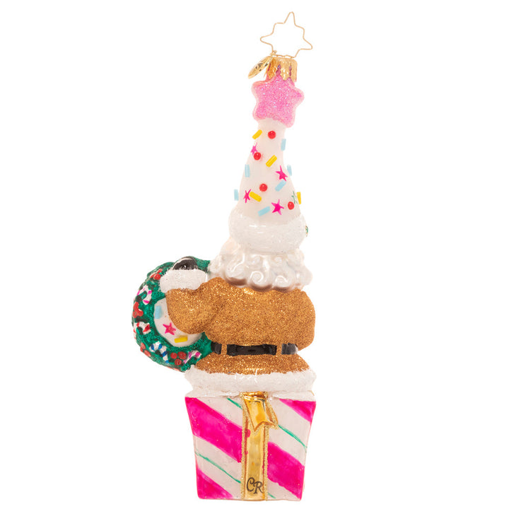 Back - Ornament Description - Christmas Confetti Santa: Santa looks ready to party! Donning a fun and colorful hat topped with candy sprinkles and a shimmering pink star, he's hoping your holiday season is extra sweet!