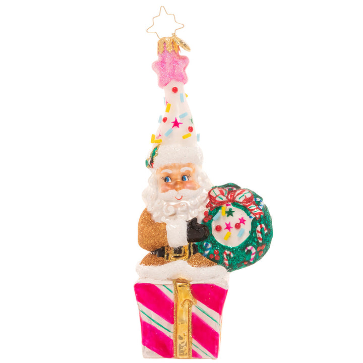 Front - Ornament Description - Christmas Confetti Santa: Santa looks ready to party! Donning a fun and colorful hat topped with candy sprinkles and a shimmering pink star, he's hoping your holiday season is extra sweet!