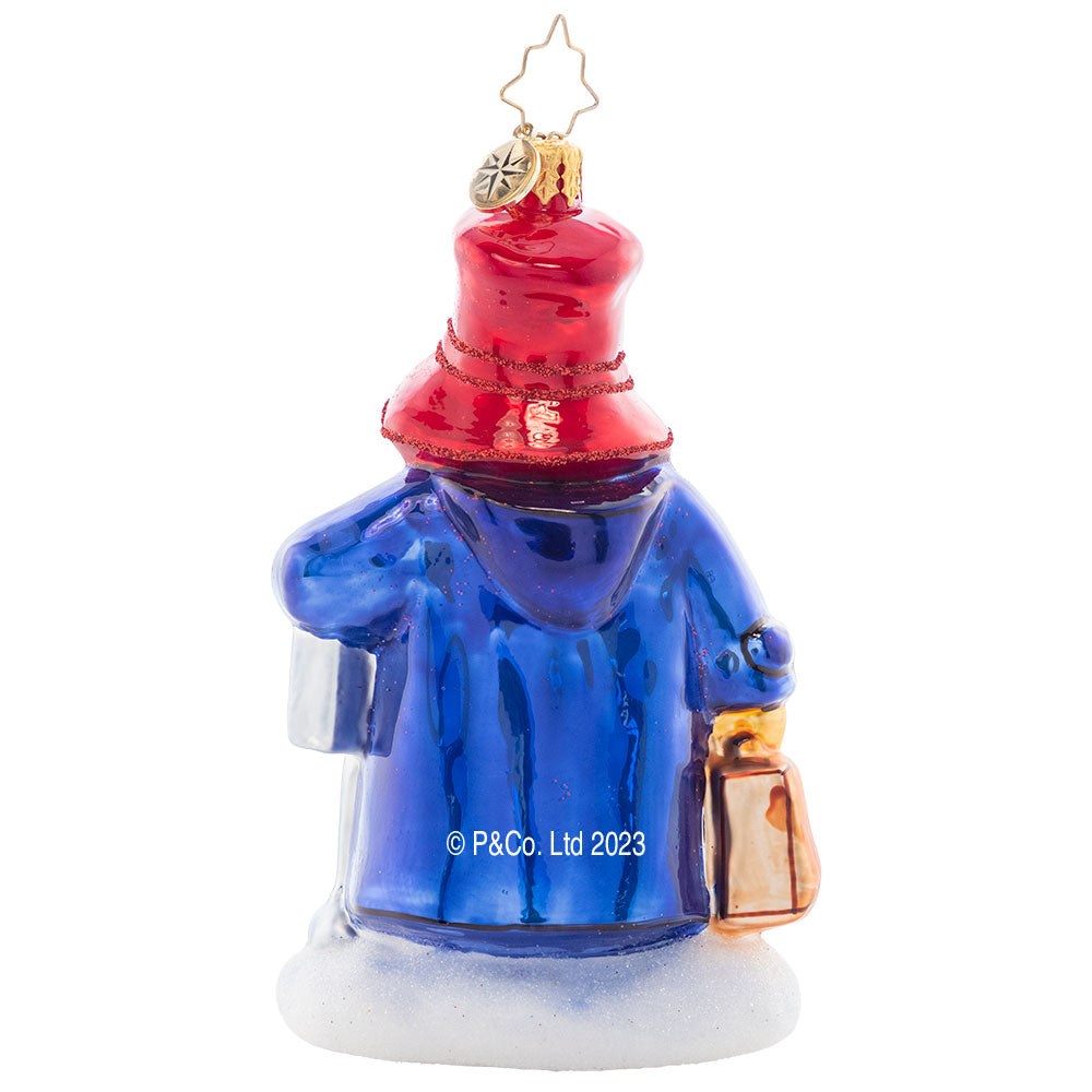 Back - Ornament Description - One-Way Ticket to Paddington™ - Who doesn't want to be home for the holidays? Make the trip alongside Paddington™ as we reconnect with family and friends this holiday season in the spirit of togetherness.