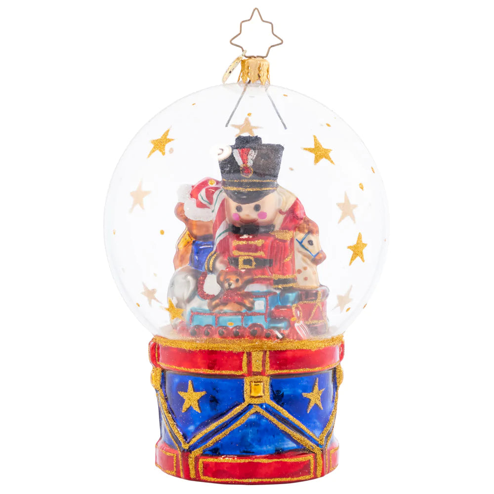 Snowglobe Description - Toyland Treasures Snow Globe: A bountiful globe full of toys captures the treasure of life's many joys. Partake in the Christmastime wonder and cherish the gifts beneath the globe they are under.