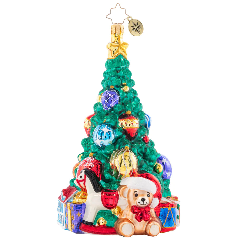 Front - Ornament Description - Tastefully Trimmed Tree: A tree lined with toys fills a child's heart with great joy! With presents ready to delight this tree shines from the greatest of heights.