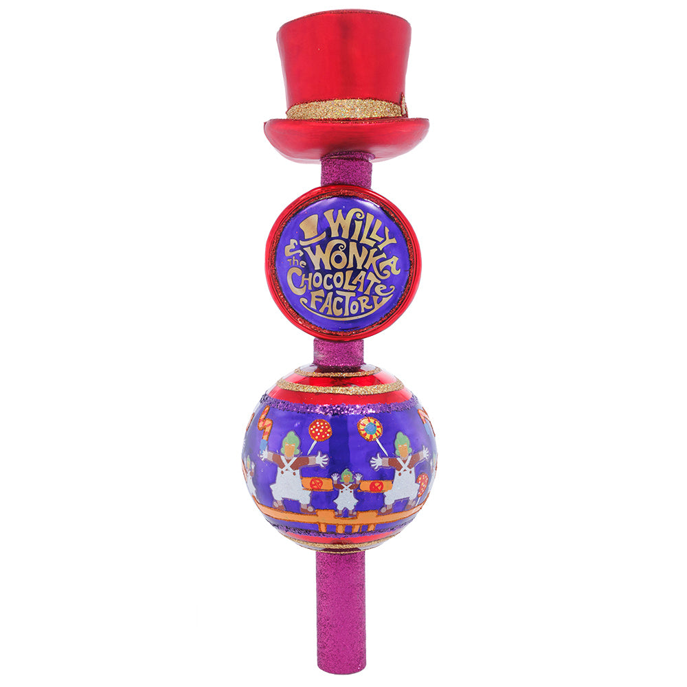 Christmas Finial Description - Wonka's Golden Ticket Topper: This whimsical Willy Wonka finial is inspired by the chocolate-filled film that is beloved by many. A unique piece decorated with dancing Oompa Loompas, colorful candies, and the coveted Golden Ticket, this tasty tree topper transports us to Wonka’s world. You can just imagine little Charlie Bucket looking up his Christmas tree and seeing Wonka's hat tipped ever so jauntily, stirring up all kinds of hopes, dreams, wonder and chocolate!