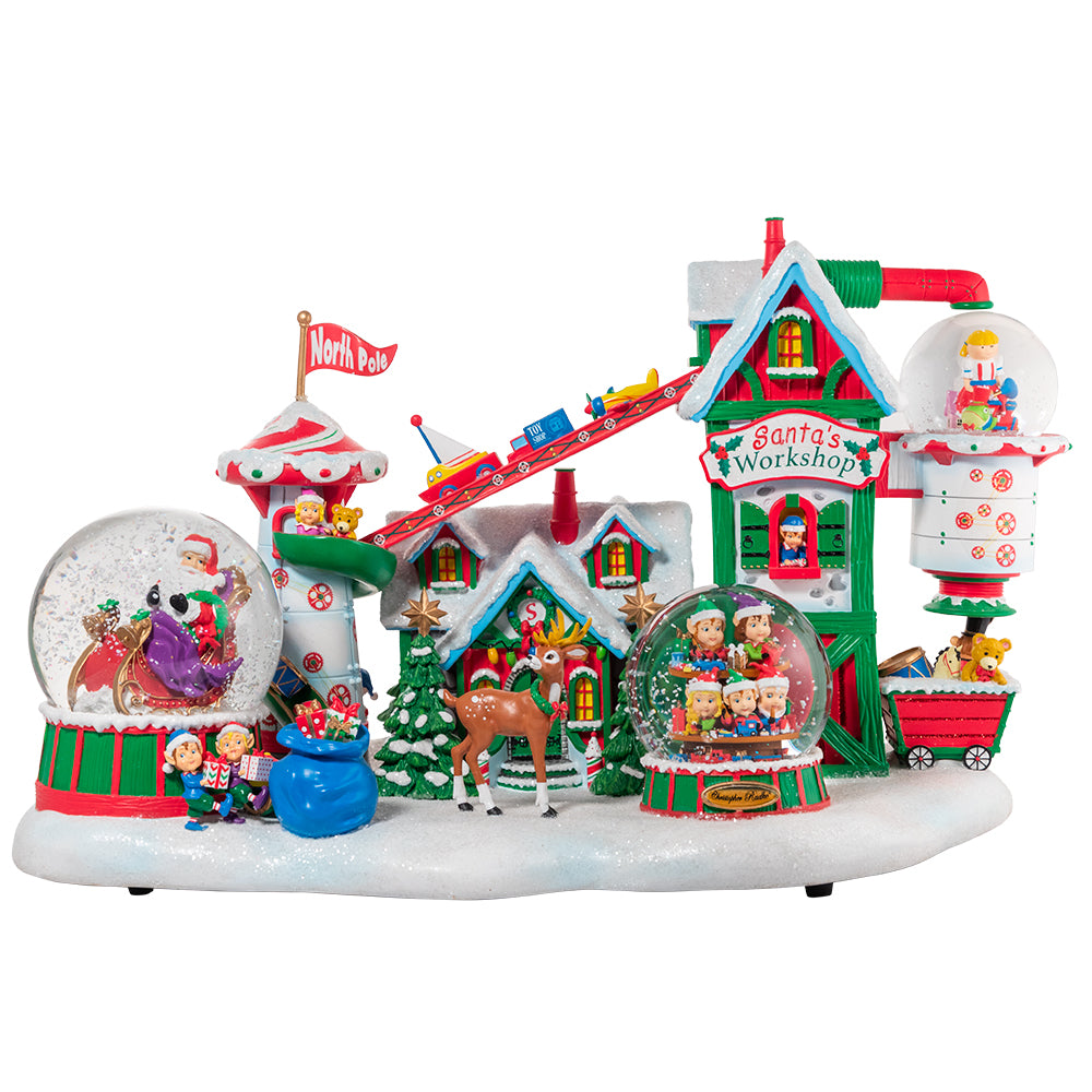 Snowglobe Description - Toy Factory: Preparing for Christmas day is quite the production! Transport yourself to Santa's wonderful North Pole workshop with this intricate, multi-faceted snowglobe. This magical, musical piece features a team of cheerful elves building toys for the good little girls and boys. Santa is ready to lead the way atop his trusty sleigh, accompanied by Dashing Donner from his reindeer team.