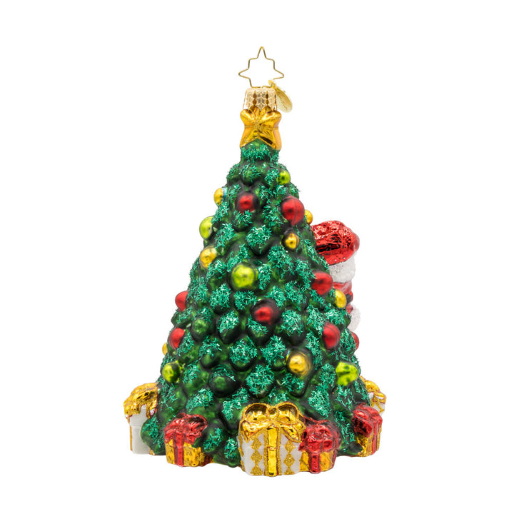 Santa's 2025 Tree Trim. Santa is seen decorating the Christmas tree with all the trimmings. Tree is dated with "2025." View of back.