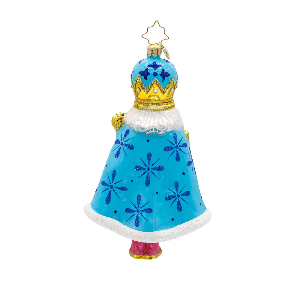 Choral Charm Nutcracker ornament. With his dazzling crown, shimmering cape, and colorful outfit. View of back.