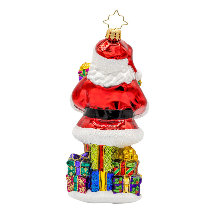 Santa's Stocking Stuffers ornament. Santa wearing his classic red suit, has presents stacked in both arms and around his feet. View of back.
