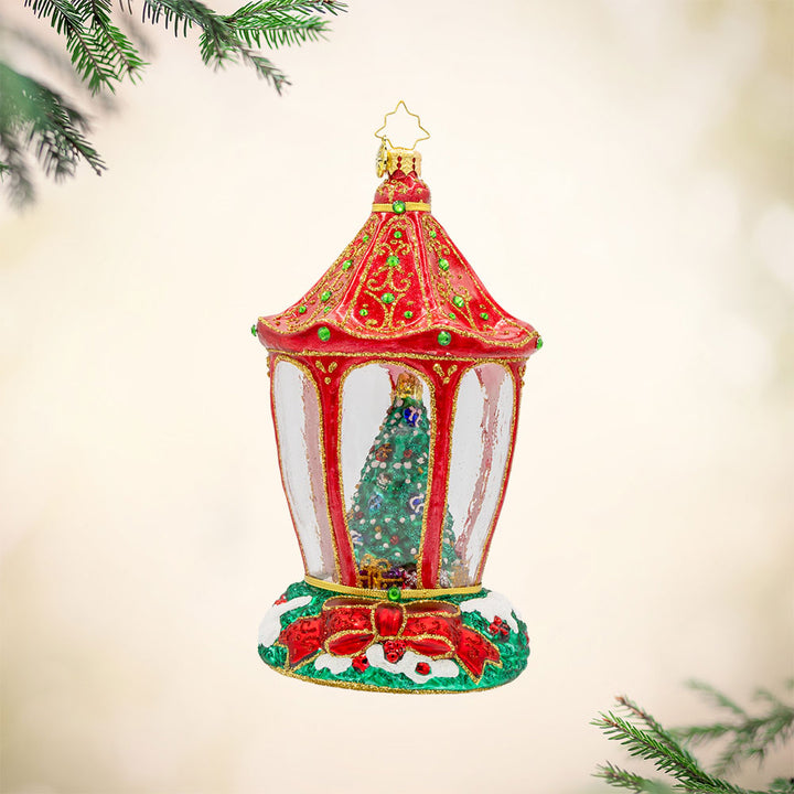 Sparkle 'n Spruce Lantern ornament. A magical winter wonderland awaits inside this charming Christmas lantern accompanied by a twinkling tree and cozy bear. View of front. 