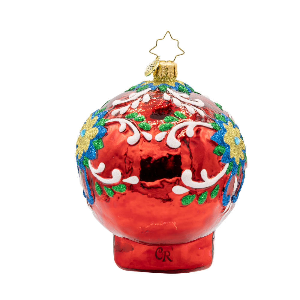Calavera Fiesta ornament. Day of the Dead decorated skull with vibrant colors and intricate details. View of back.