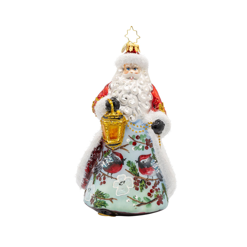 Cardinal Kris Kringle ornament. This enchanting ornament features a snowy scene, a charming cardinal companion, and a touch of regal elegance. View of front. 
