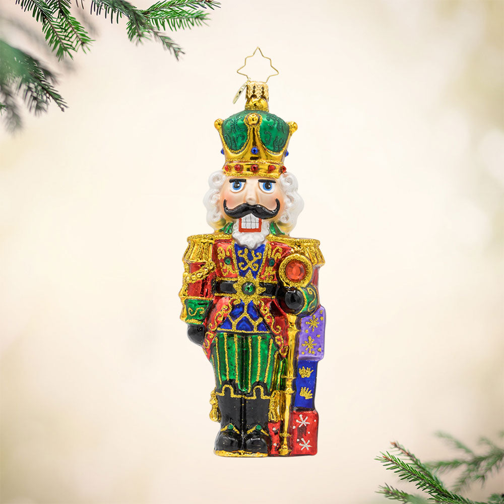 Yuletide Sentinel ornament. This Nutcracker features a sparkling coat and brave expression. View of front. 