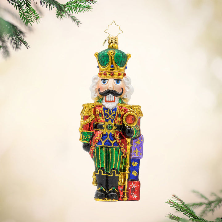 Yuletide Sentinel ornament. This Nutcracker features a sparkling coat and brave expression. View of front. 
