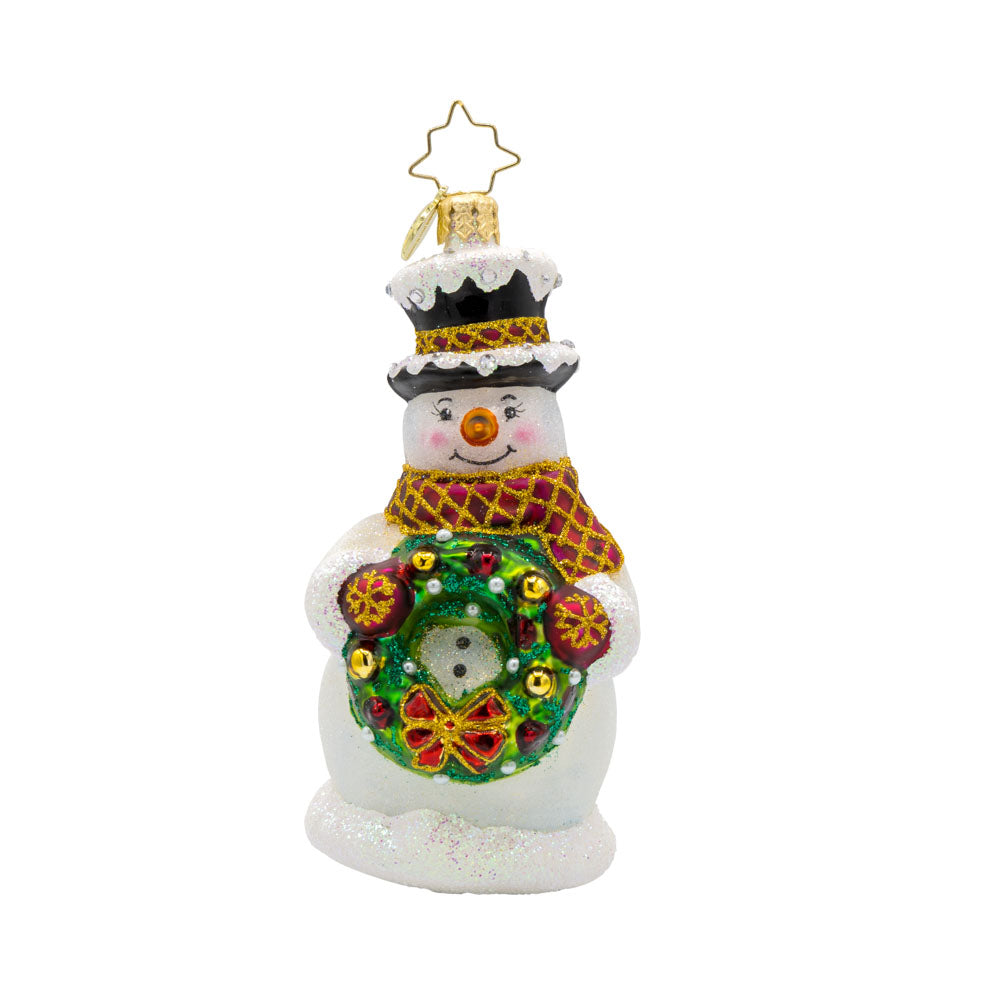Merry Mittens ornament. A snowman with his wreath-tastic accessory full of red and gold ornaments. View of front. 