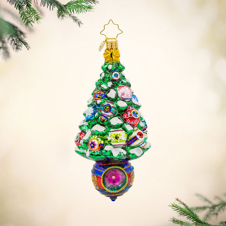 Vintage Holiday Spruce ornament. A Christmas tree decorated with vintage ornaments. A vintage ornament makes up the base of the tree. View of front.