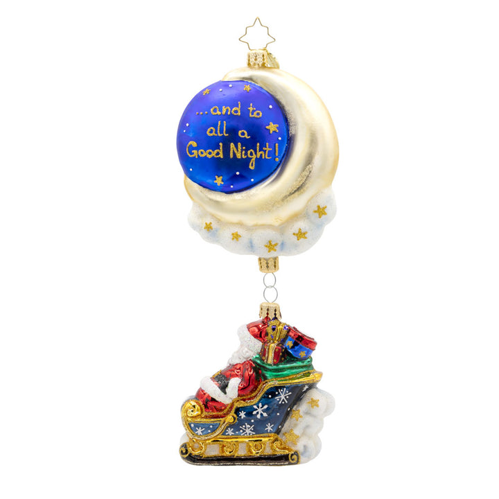 Moonlight Sleigh Ride ornament. With his shimmering moon, twinkling stars, and festive sleigh, Santa soars through the night, delivering presents to children around the world. "...and to all a Good Night!" written on back. View of back.