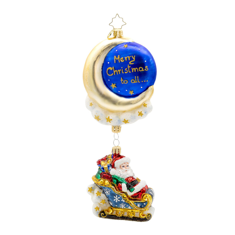 Moonlight Sleigh Ride ornament. With his shimmering moon, twinkling stars, and festive sleigh, Santa soars through the night, delivering presents to children around the world. "Merry Christmas to all..." written on front. View of front.