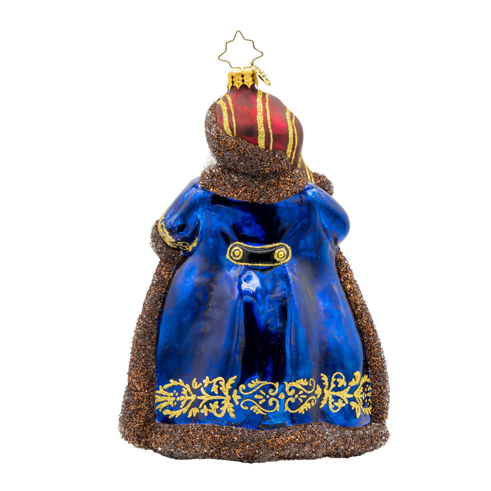 Keymaster Klaus ornament. Decked in a lush burgundy coat with champagne glitter accents and an intricate key motif. View of back.