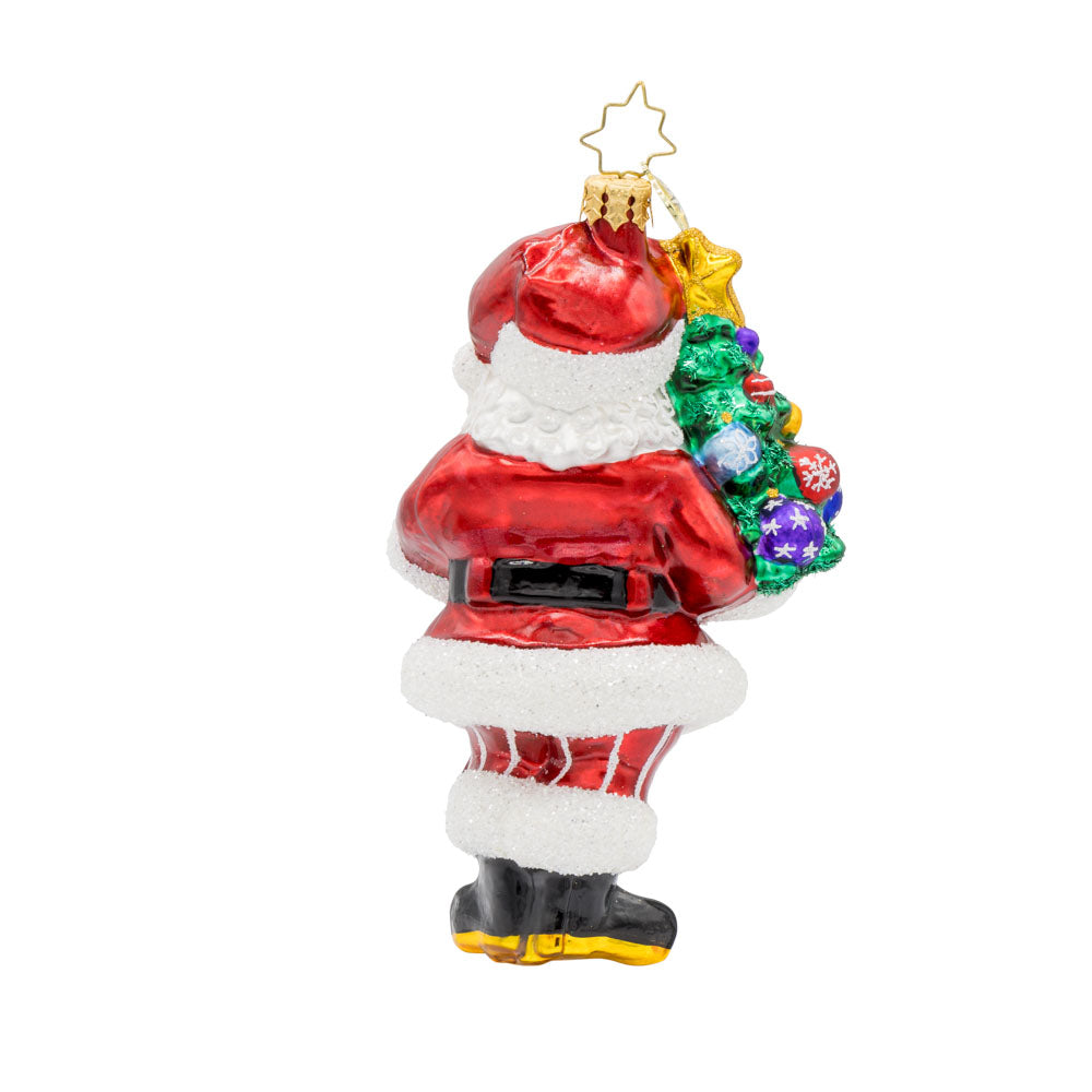 Tree-Totin' Santa ornament. Santa carries a mini decorated Christmas tree.  View of back.