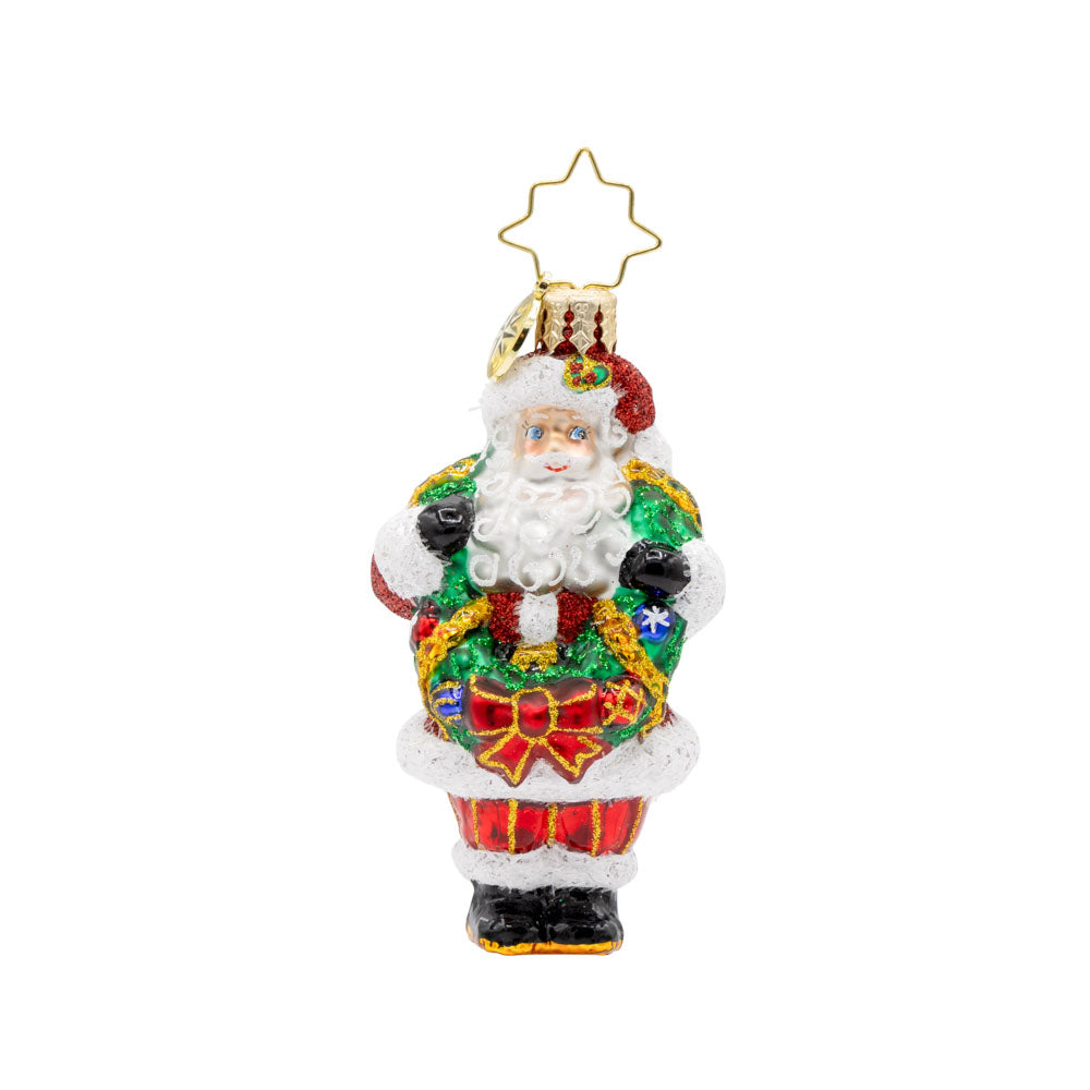 Wreath Wrangler Claus Gem ornament. Santa is seen here with a decorated Christmas wreath around his neck. View of front. 