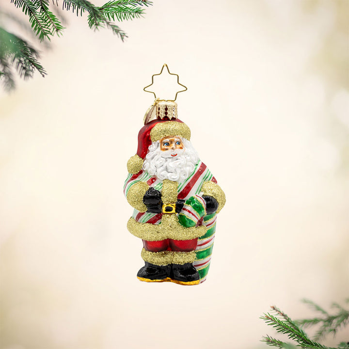 Jolly Old Candy Cane Claus Gem ornament. Santa wears a candy-cane striped coat with gold fur trim. A giant green candy-cane in his hand. View of front.