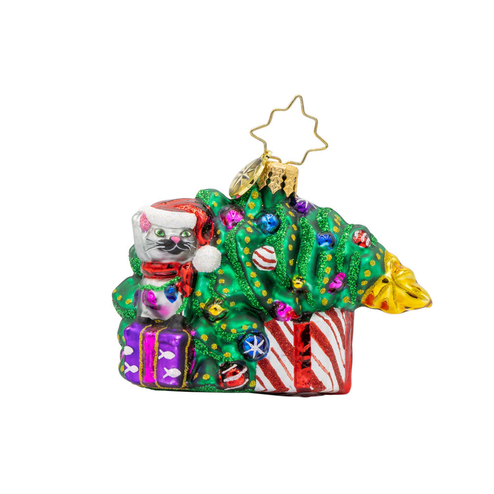 Festive Feline Fiasco Gem ornament. A grey cat sits on top of a present next to a half-fallen decorated Christmas tree. View of front. 