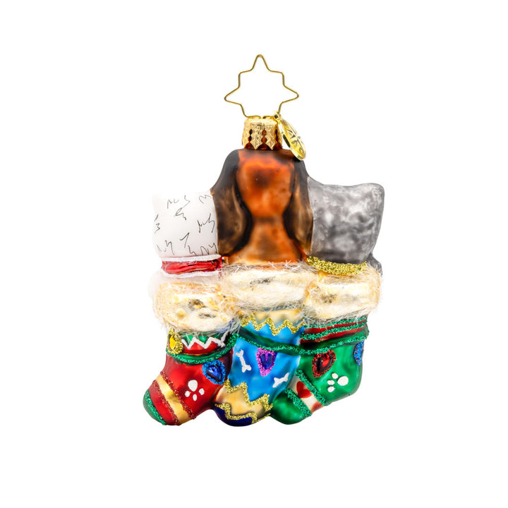 Puppy Presents Gem ornament. Three pups are seen here snuggled in festive stockings. View of back.