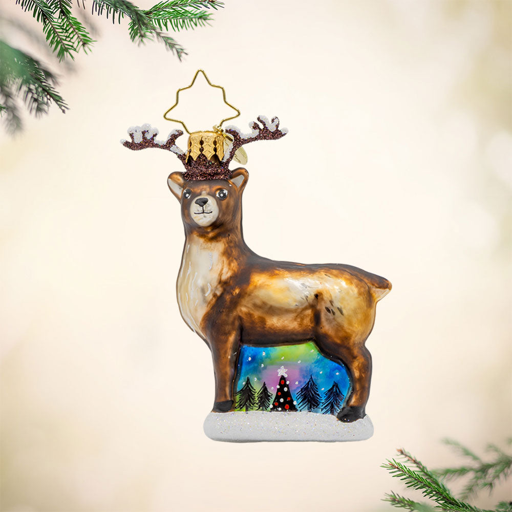 Twilight Reindeer Elegance Gem ornament. A reindeer is seen with ethereal hues of the Northern lights behind him. View of front. 