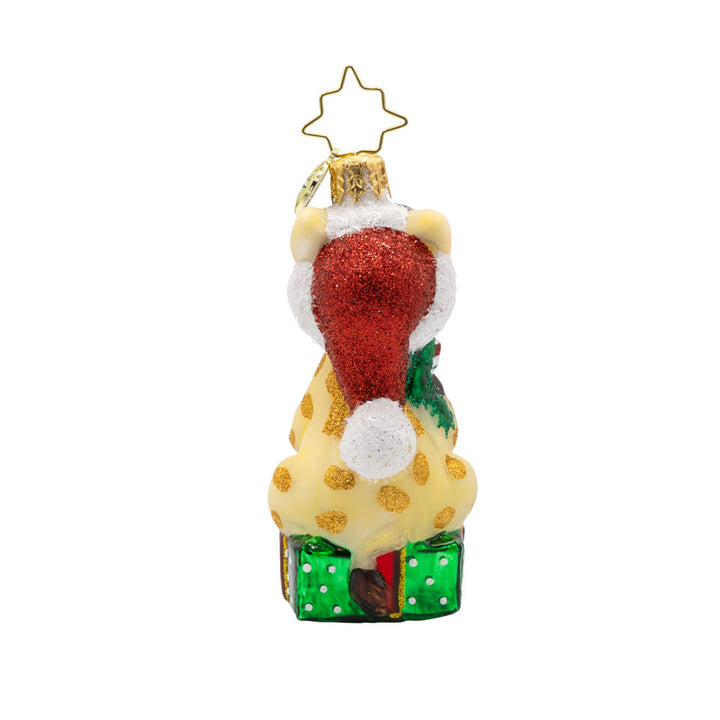 Stacked with Sweetness Gem ornament. A giraffe sits atop a gift with a stocking full of candy canes in hand. View of back.