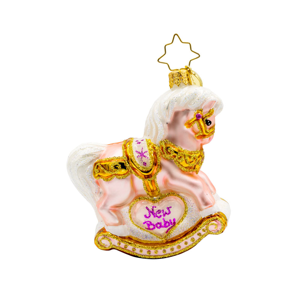 Baby's First Christmas Filly Gem ornament. A powder pink rocking horse with "New Baby" written on the side. View of back.