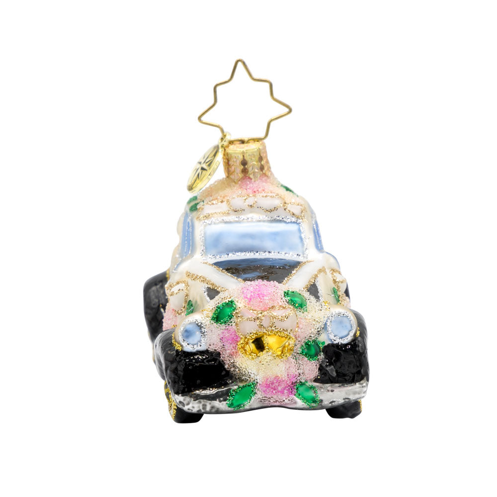 Wedding Day Wheels Gem ornament. A black and white car adorned with pink flowers and white bows. View of right side.
