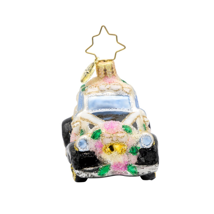 Wedding Day Wheels Gem ornament. A black and white car adorned with pink flowers and white bows. View of right side.