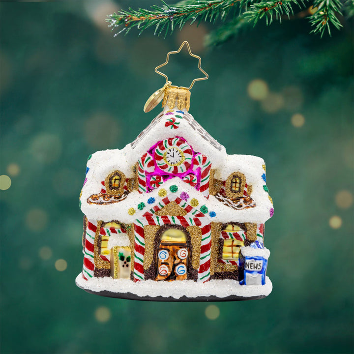 Sweet Tooth Station Gem ornament. A gingerbread train station decorated with sweet treats. View of front. 