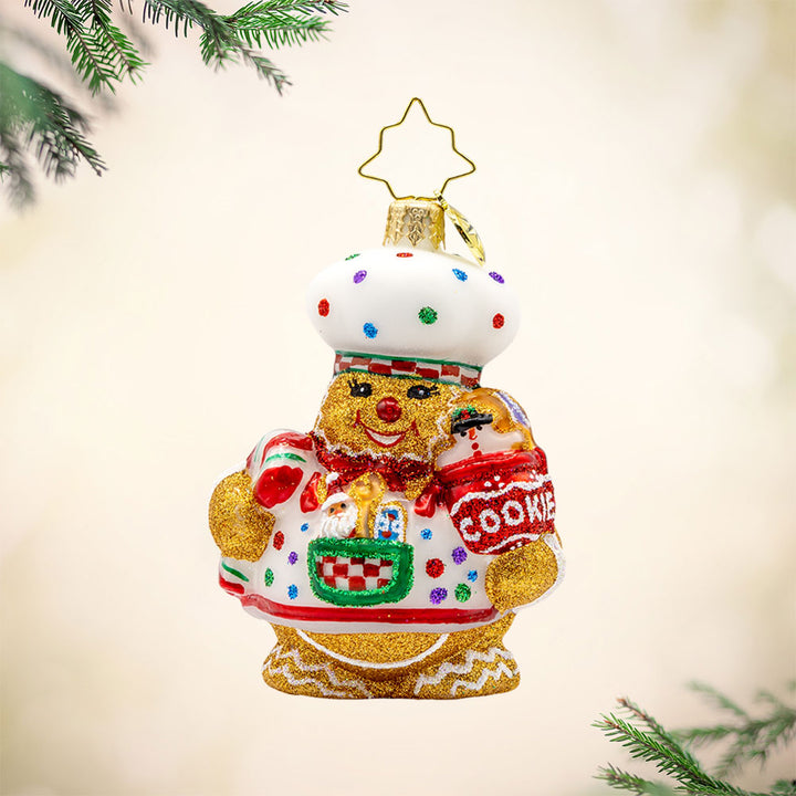 Sugary Chef Gem ornament. This gingerbread man is dressed as a baker with a cookie jar in hand. View of front. 