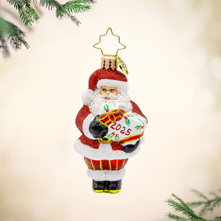 Santa's Special Gift 2025 Gem ornament. Santa holds a white giftbox dated "2025." View of front. 