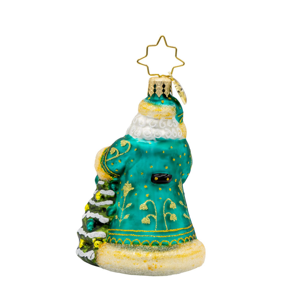 Santa's Tinsel Touch Gem ornament. Santa dons a green and gold intricately detailed robe as he tends to a tiny Christmas tree. View of back.