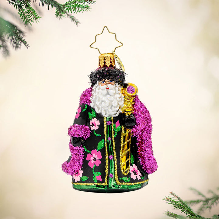 Midnight Blossom St. Nick Gem ornament. Santa dons a black and pink robe with hand-painted floral designs. He holds a gold scepter. View of front. 