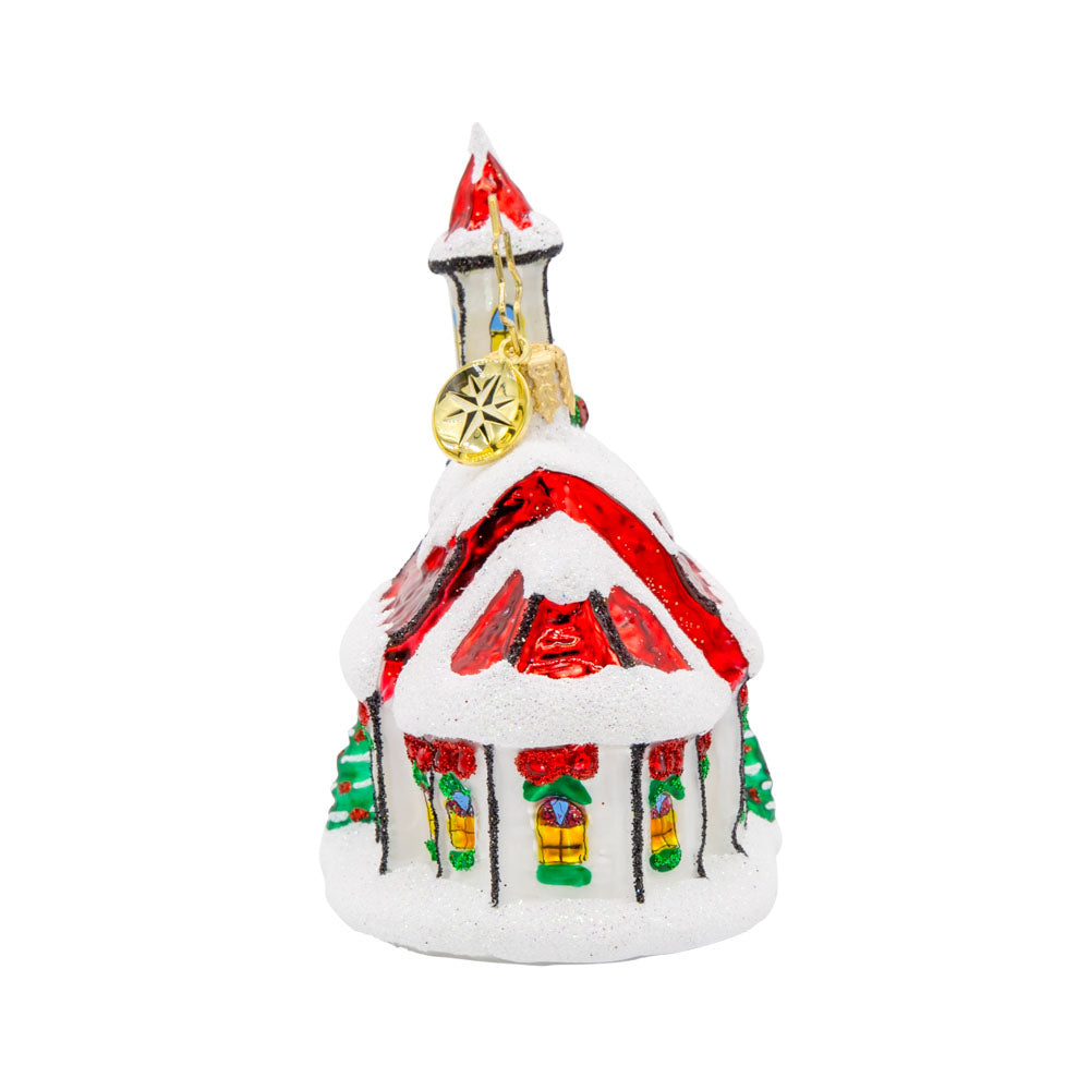 Holly Bell Chapel Gem ornament. A snow-covered chapel with a red roof adorned with wreathes galore. View of back.