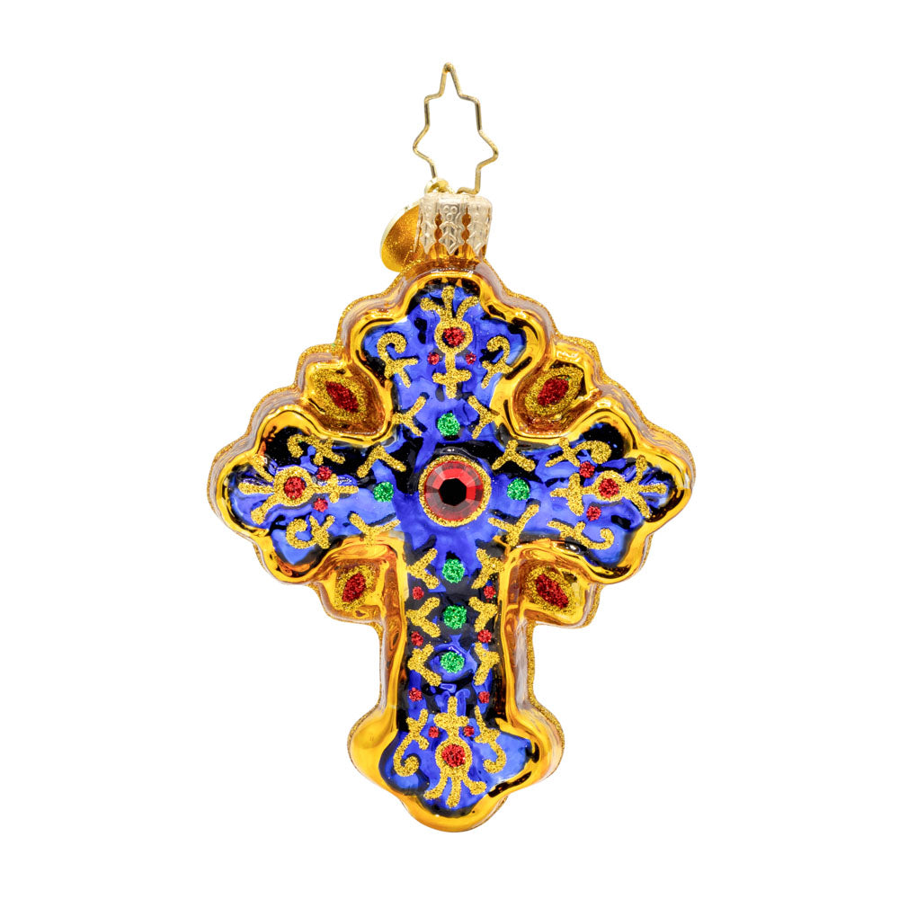 Sacred Season Cross Gem ornament. A gold and blue cross adorned with red and green jewels. View of back.